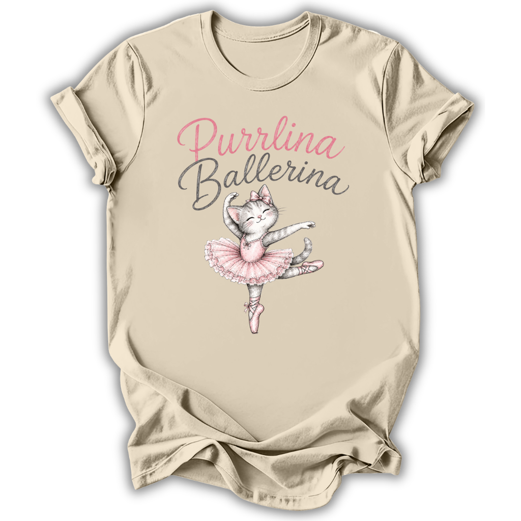 A beige short-sleeve t-shirt with a 'Purrlina Ballerina' graphic featuring a cartoon cat ballerina in a pink tutu, displayed on a clean white background.