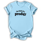 A light blue short-sleeve crewneck t-shirt with the text 'i'm kind of a prodigy' printed in black across the chest, displayed on a clean white background.