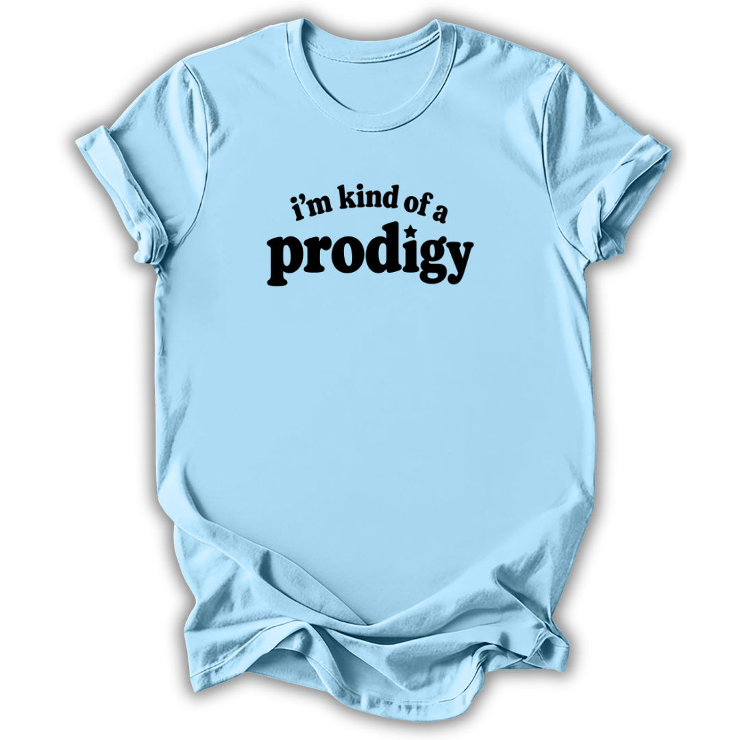 A light blue short-sleeve crewneck t-shirt with the text 'i'm kind of a prodigy' printed in black across the chest, displayed on a clean white background.