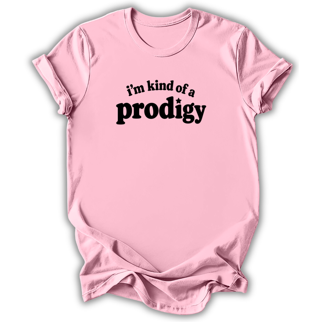A light pink short-sleeve crewneck t-shirt with the phrase 'i'm kind of a prodigy' printed in black across the chest, displayed on a clean white background.