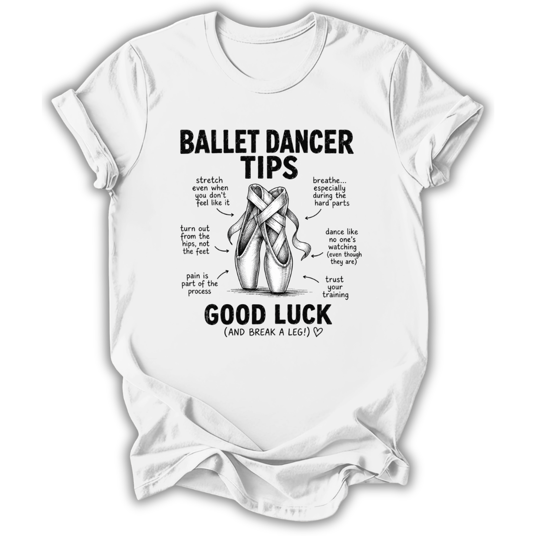 A white short-sleeve crewneck t-shirt with a black graphic print on the front. The graphic features the text 'BALLET DANCER TIPS' and 'GOOD LUCK (AND BREAK A LEG!)' surrounding an illustration of ballet shoes with handwritten-style tips.