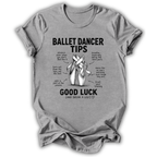 A light gray short-sleeve t-shirt with a black graphic print detailing ballet dancer tips and a central illustration of pointe shoes, displayed against a plain white background.