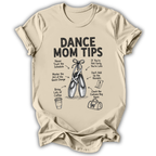 A beige short-sleeve crewneck t-shirt with a black graphic print titled 'DANCE MOM TIPS' featuring illustrations of ballet slippers and dance-related advice, shown on a plain white background.