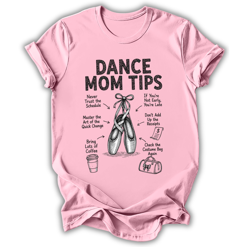A light pink short-sleeve t-shirt with a black graphic print titled 'DANCE MOM TIPS' featuring illustrations of ballet slippers and dance-related tips, shown on a plain white background.
