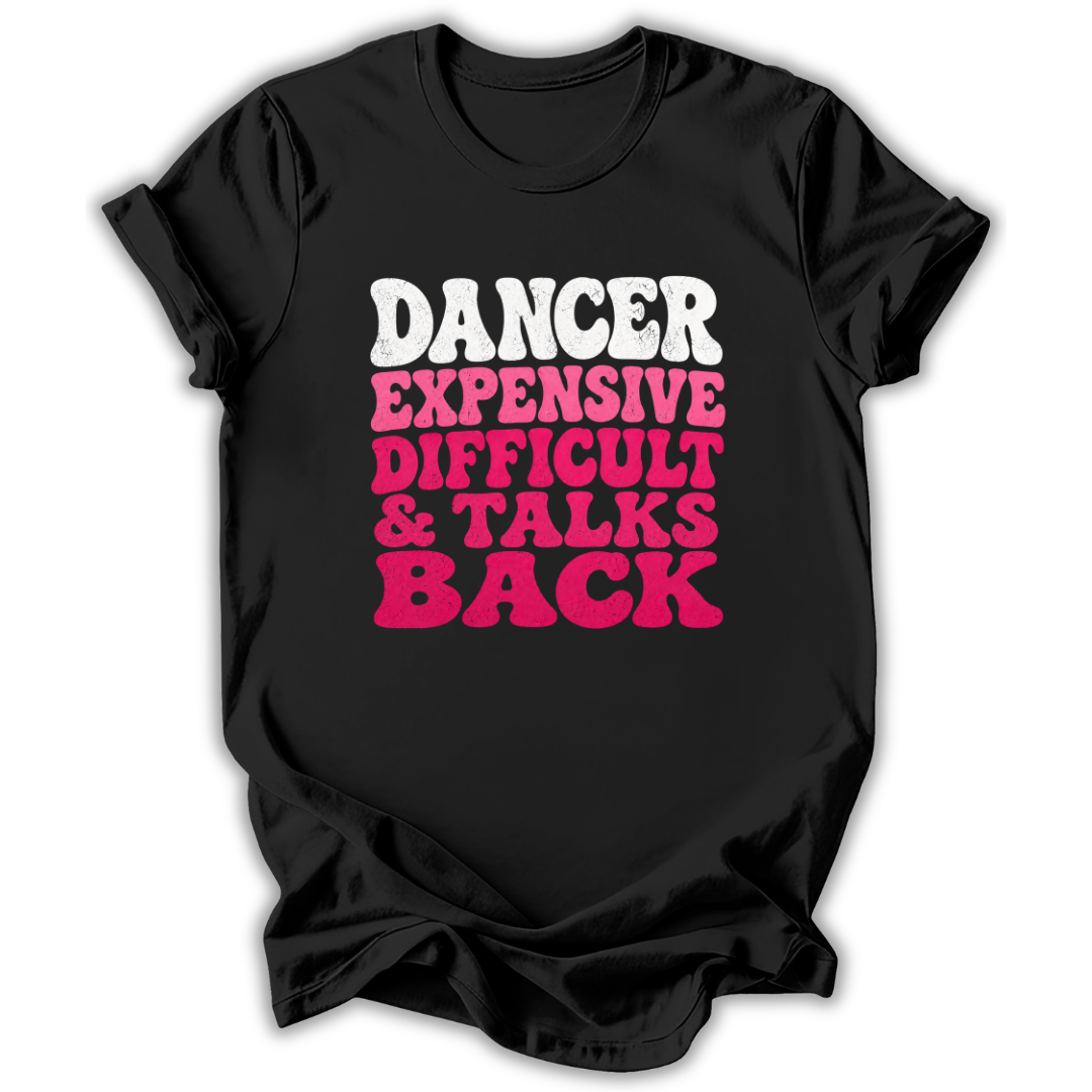 A black short-sleeve t-shirt with a bold graphic text print reading 'DANCER EXPENSIVE DIFFICULT & TALKS BACK' in white and pink lettering, shown on a plain white background.