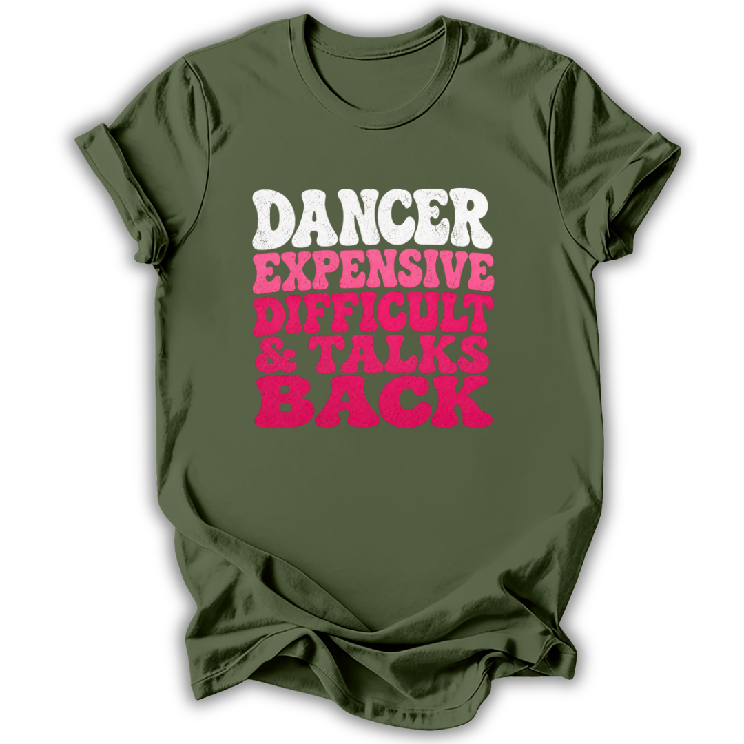 An olive green short-sleeve t-shirt with a distressed text graphic on the front reading 'DANCER EXPENSIVE DIFFICULT & TALKS BACK' in white and bright pink lettering, shown against a plain white background.
