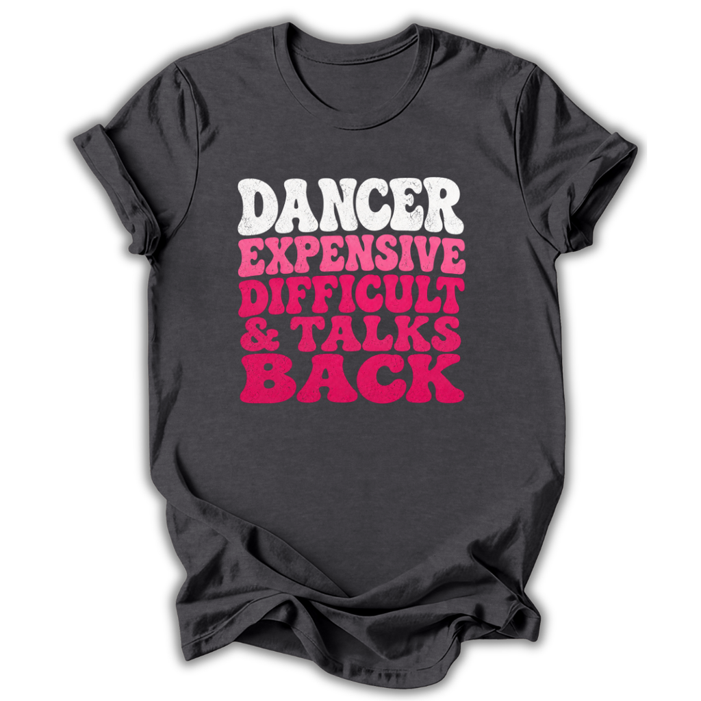 A dark charcoal gray t-shirt with a graphic text print reading 'DANCER EXPENSIVE DIFFICULT & TALKS BACK' in white and bright pink letters, displayed on a clean white background.