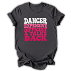 A dark charcoal gray t-shirt with a graphic text print reading 'DANCER EXPENSIVE DIFFICULT & TALKS BACK' in white and bright pink letters, displayed on a clean white background.