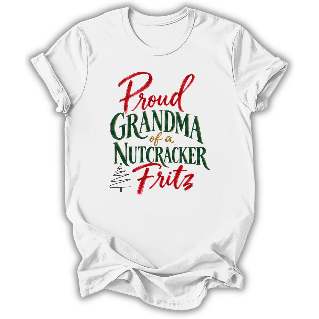 A white short-sleeve crewneck t-shirt with a festive graphic reading 'Proud Grandma of a Nutcracker Fritz' in red and green lettering, displayed on a clean white background.