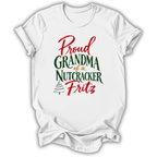 A white short-sleeve crewneck t-shirt with a festive graphic reading 'Proud Grandma of a Nutcracker Fritz' in red and green lettering, displayed on a clean white background.