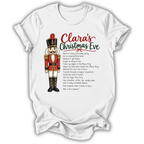 A white short-sleeve t-shirt with a graphic print of a nutcracker soldier and the text 'Clara's Christmas Eve' followed by a poem, displayed on a clean white background.