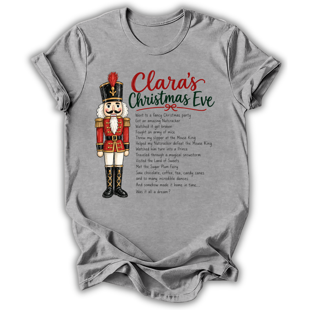 A heather gray short-sleeve t-shirt with a distressed wash, featuring a graphic print of a nutcracker soldier and the text 'Clara's Christmas Eve' with a poem printed on the front.