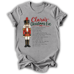 A heather gray short-sleeve t-shirt with a distressed wash, featuring a graphic print of a nutcracker soldier and the text 'Clara's Christmas Eve' with a poem printed on the front.