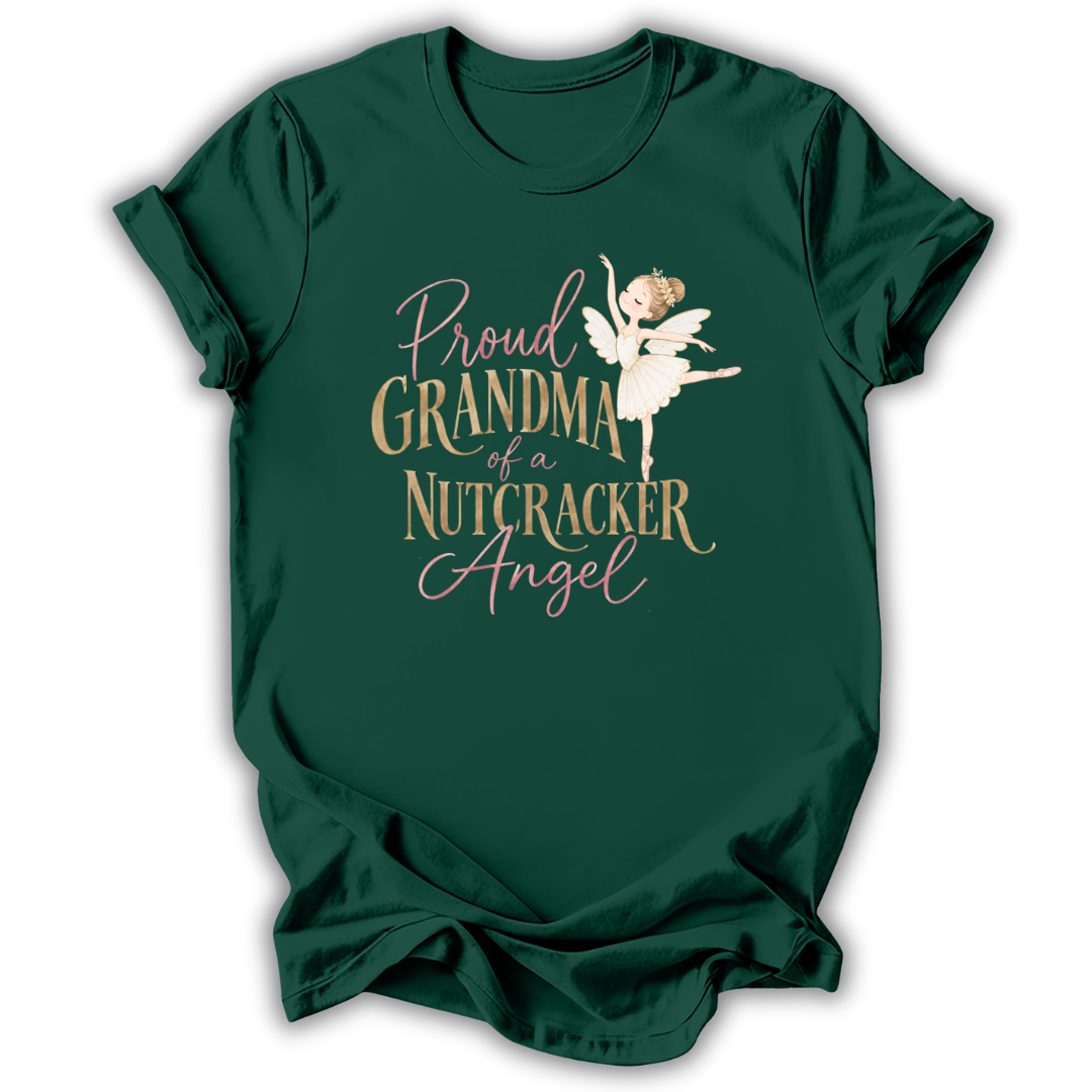 A dark green short-sleeve t-shirt with a graphic print that reads 'Proud GRANDMA of a NUTCRACKER Angel' in gold and pink lettering, featuring an illustration of a nutcracker angel in a white dress.