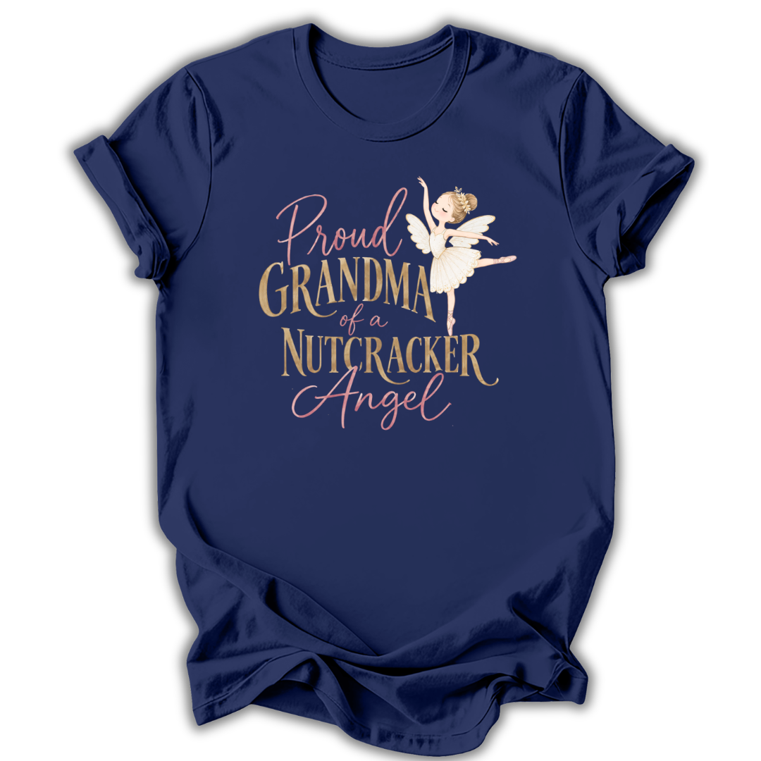 A navy blue short-sleeve t-shirt with a graphic print on the front. The graphic features a white ballerina nutcracker and text that reads 'Proud GRANDMA of a NUTCRACKER Angel' in gold and pink lettering, set against a plain white background.