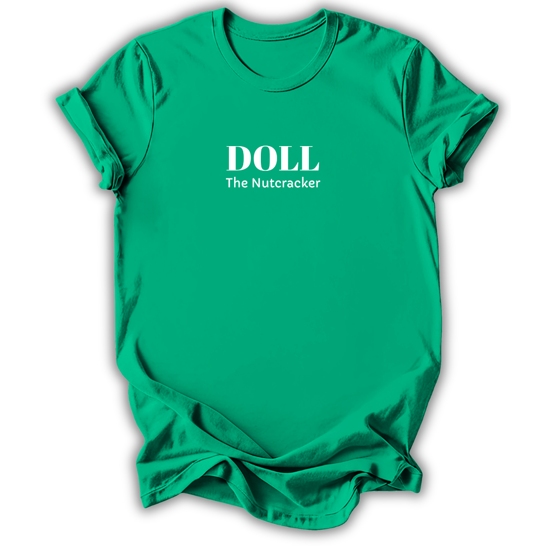 A bright green short-sleeve crewneck t-shirt with white printed text reading 'DOLL The Nutcracker' on the chest, displayed against a clean white background.