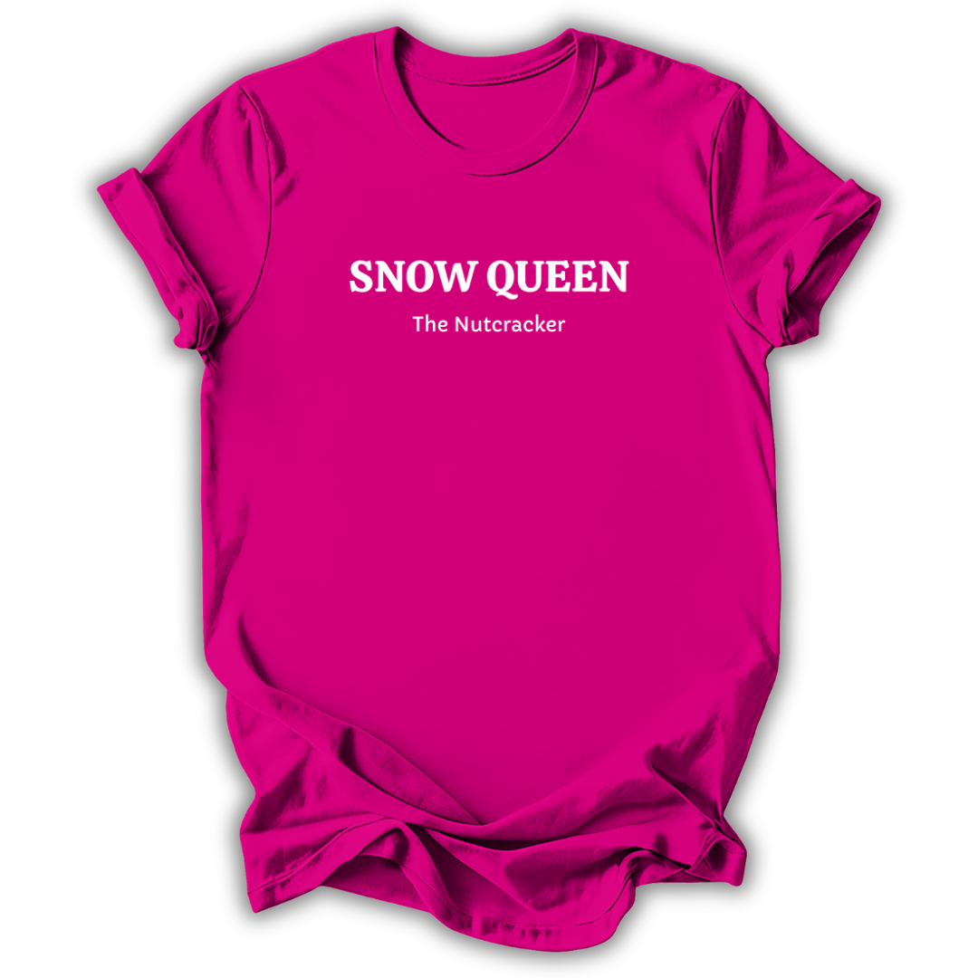 A bright pink short-sleeve crewneck t-shirt with white printed text reading 'SNOW QUEEN' and 'The Nutcracker' on the chest, shown against a plain white background.