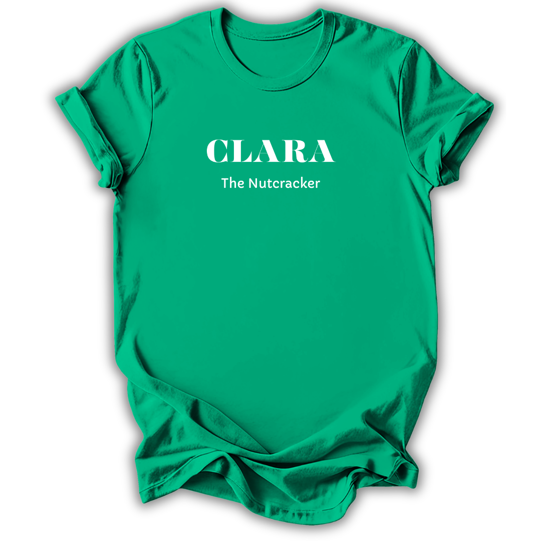 A bright green short-sleeve crewneck t-shirt with white printed text reading 'CLARA' and 'The Nutcracker' on the chest, shown on a plain white background.