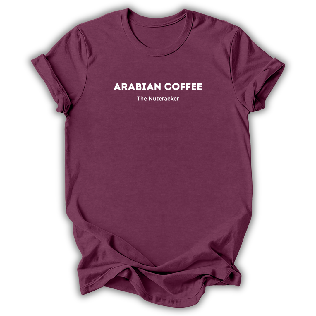 Maroon short-sleeve t-shirt with white printed text reading 'ARABIAN COFFEE' and 'The Nutcracker' underneath, displayed against a clean white background.