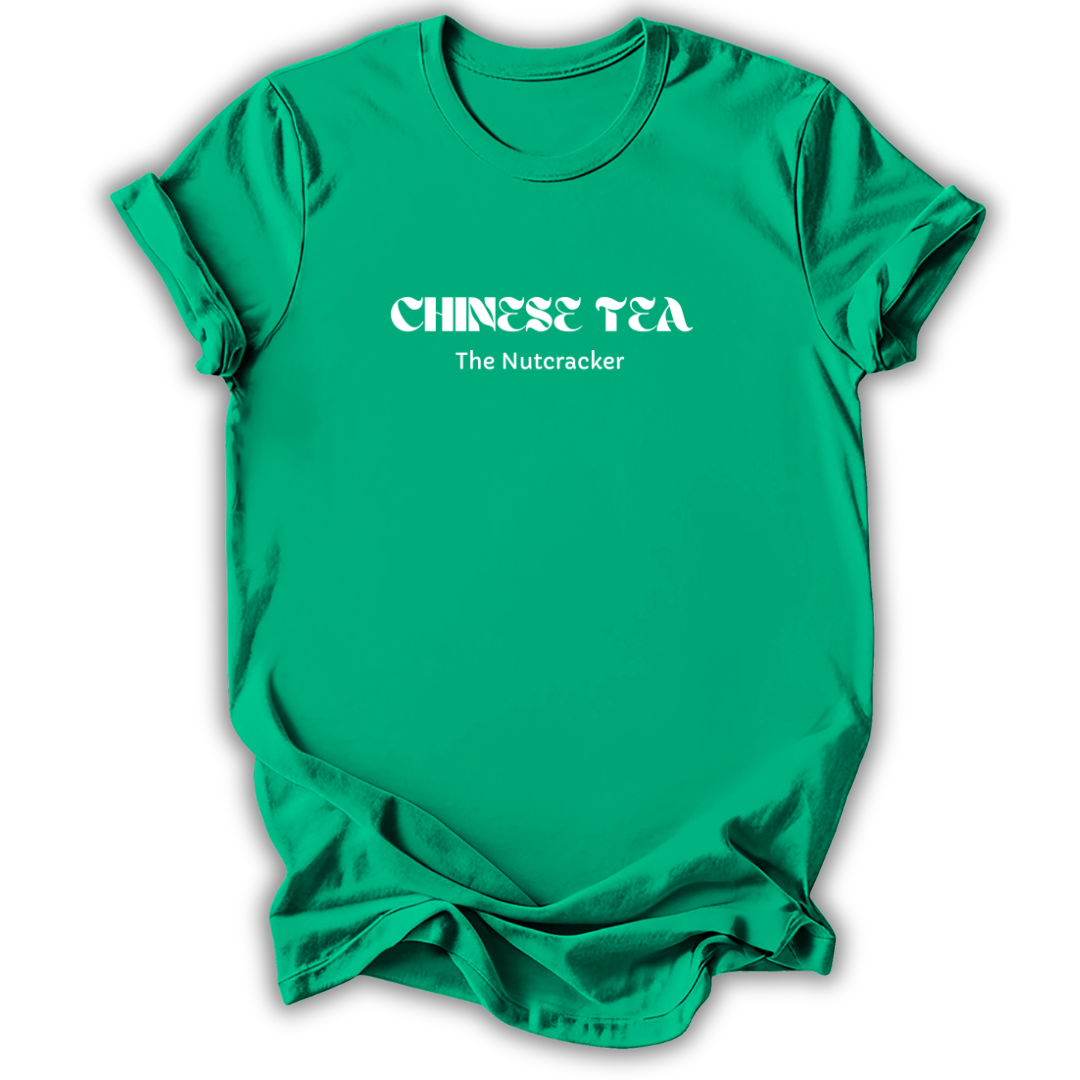 A bright green short-sleeve crewneck t-shirt with white text on the chest reading 'CHINESE TEA' in a stylized font and 'The Nutcracker' underneath, shown on a plain white background.
