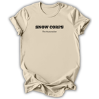 Natural short-sleeve t-shirt with black printed text reading 'SNOW CORPS' and 'The Nutcracker' underneath, displayed flat against a white background.