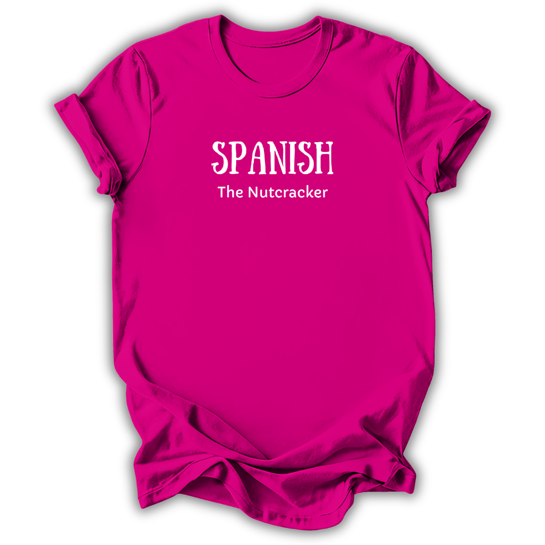 A bright pink short-sleeve t-shirt with white printed text reading 'SPANISH The Nutcracker' on the chest, shown against a plain white background.