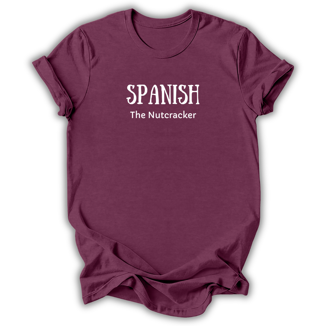A maroon short-sleeve t-shirt with white printed text reading 'SPANISH The Nutcracker' on the chest, shown against a plain white background.