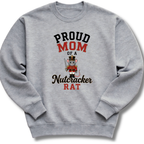 A heather gray crewneck sweatshirt featuring a graphic print that reads 'PROUD MOM OF A Nutcracker RAT' with an illustration of a nutcracker mouse.
