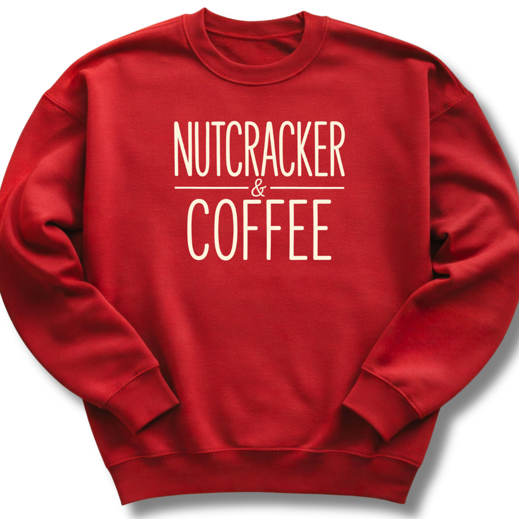 A red crewneck sweatshirt with the words 'NUTCRACKER & COFFEE' printed in white across the chest, displayed on a clean white background.
