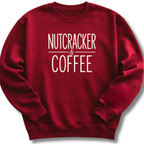 A dark red crewneck sweatshirt with the words 'NUTCRACKER & COFFEE' printed in a cream-colored serif font on the chest, displayed against a clean white background.