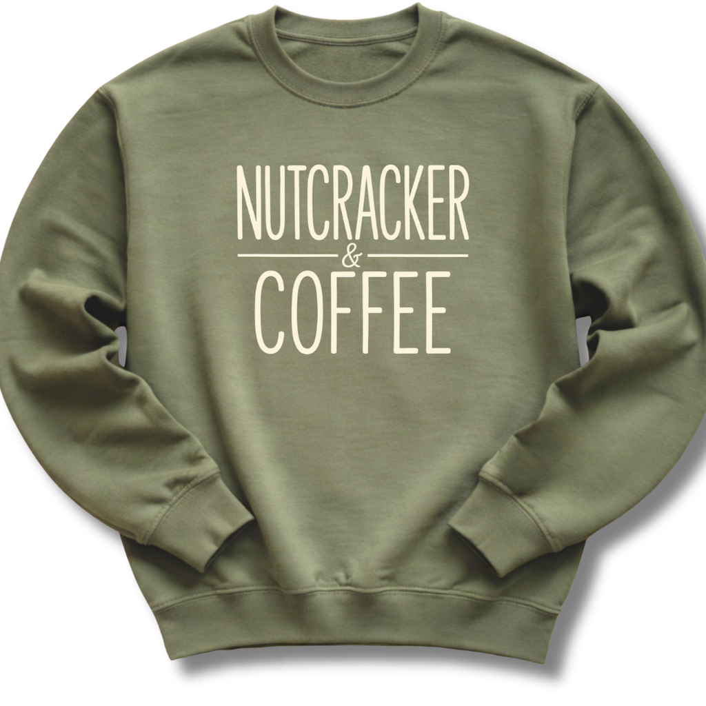 An olive green crewneck sweatshirt with the words 'NUTCRACKER & COFFEE' printed in a cream-colored serif font on the chest, displayed against a clean white background.