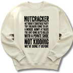 An off-white crewneck sweatshirt with black distressed text on the front that reads 'NUTCRACKER WE THROW A CHRISTMAS PARTY TOY SOLDIERS COME TO LIFE A MOUSE ARMY ATTACKS THE RAT KING GETS KILLED WITH A POINTE SHOE NOT KIDDING WE'VE DONE IT BEFORE.'.