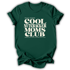 Dark green short-sleeve crewneck t-shirt with a cream-colored retro graphic that reads 'PROUD MEMBER COOL NUTCRACKER MOMS CLUB' and 'EMBRACING CHANGE, LEADING WITH LOVE.'.