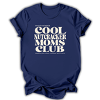 Blue short-sleeve crewneck t-shirt with a cream-colored retro graphic that reads 'PROUD MEMBER COOL NUTCRACKER MOMS CLUB' and 'EMBRACING CHANGE, LEADING WITH LOVE.'.