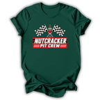 Green short-sleeve t-shirt with a 'Nutcracker Pit Crew' graphic on the chest, featuring a race flag checkered pattern and a pit crew character, displayed on a clean white background.