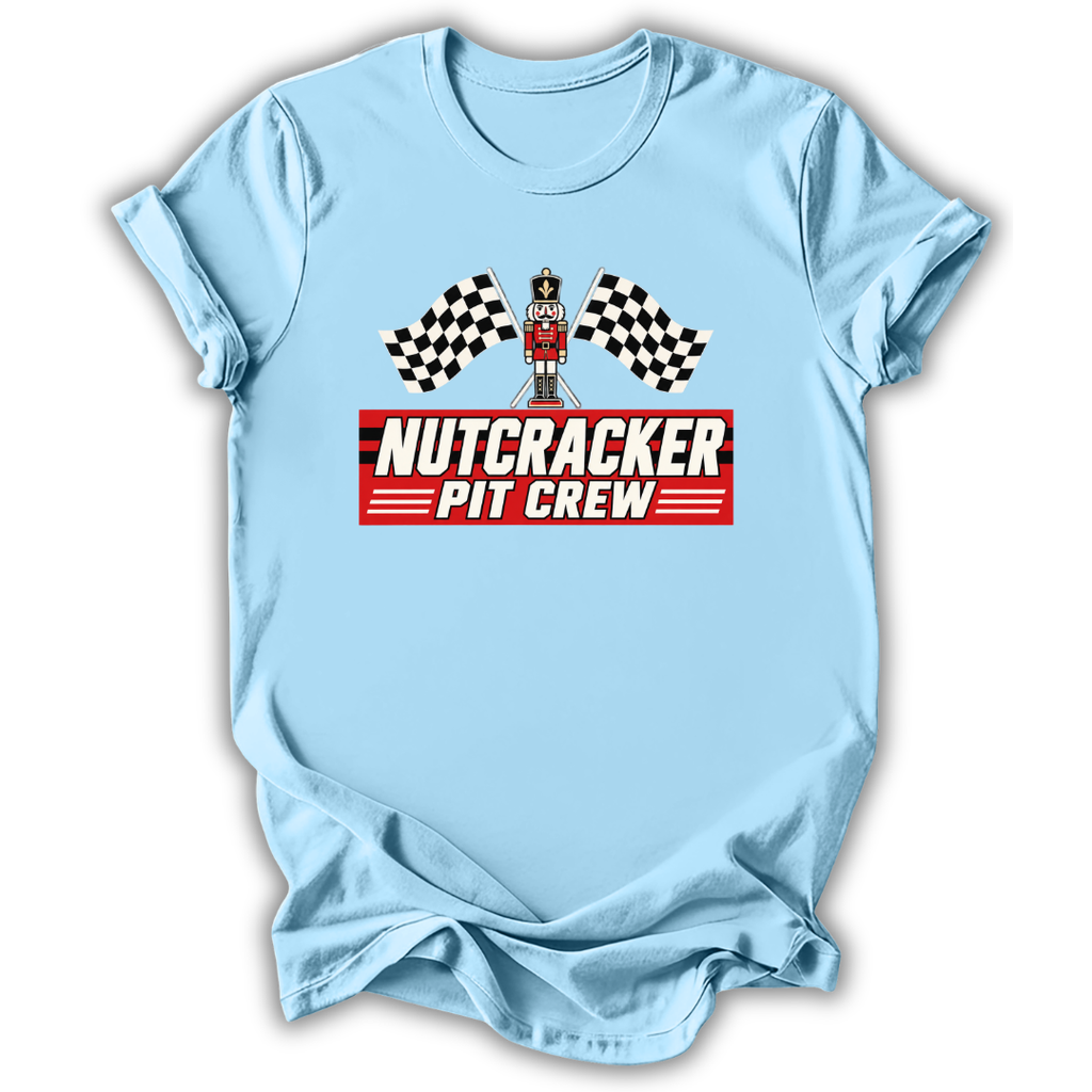 Blue short-sleeve t-shirt with a 'Nutcracker Pit Crew' graphic on the chest, featuring a race flag checkered pattern and a pit crew character, displayed on a clean white background.