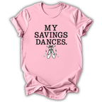 A light pink short-sleeve t-shirt with the text 'MY SAVINGS DANCES.' printed in black block letters above a graphic of white ballet slippers, shown on a white background with a drop shadow.