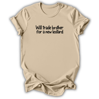 A beige short-sleeve t-shirt with black text on the chest reading 'Will trade brother for a new leotard', displayed against a white background with a soft drop shadow.