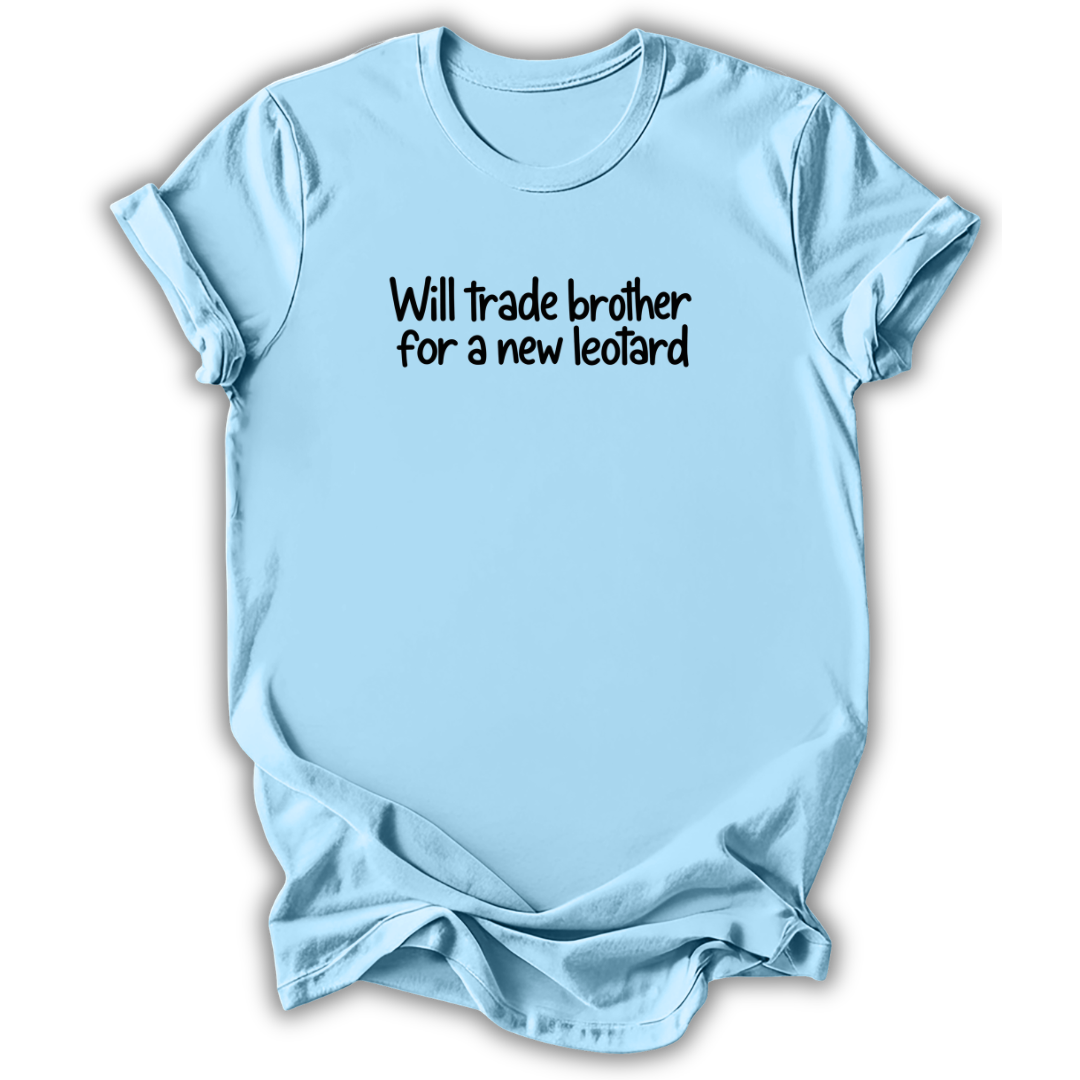A light blue short-sleeve t-shirt with the text 'Will trade brother for a new leotard' printed in black across the chest, displayed on a clean white background.