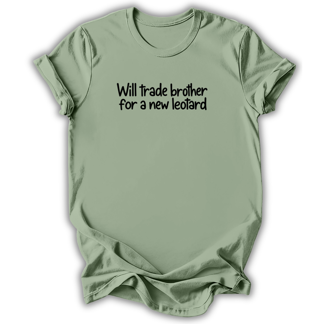 A sage green short-sleeve t-shirt with the text 'Will trade brother for a new leopard' printed in black across the chest, displayed on a clean white background.