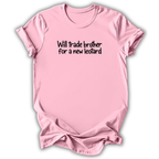 A light pink short-sleeve t-shirt with the text 'Will trade brother for a new leotard' printed in black across the chest, displayed on a clean white background.