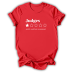 A red short-sleeve t-shirt with a white graphic print on the front reading 'Judges' above a one-out-of-five star rating system, with the phrase 'awful. would not recommend.