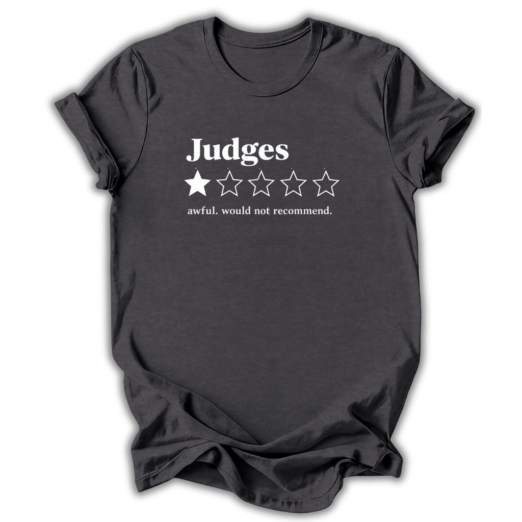 A dark charcoal gray t-shirt with a white graphic print on the front. The graphic reads 'Judges' above a one-out-of-five star rating system, with only one star filled in and the text 'awful, would not recommend.