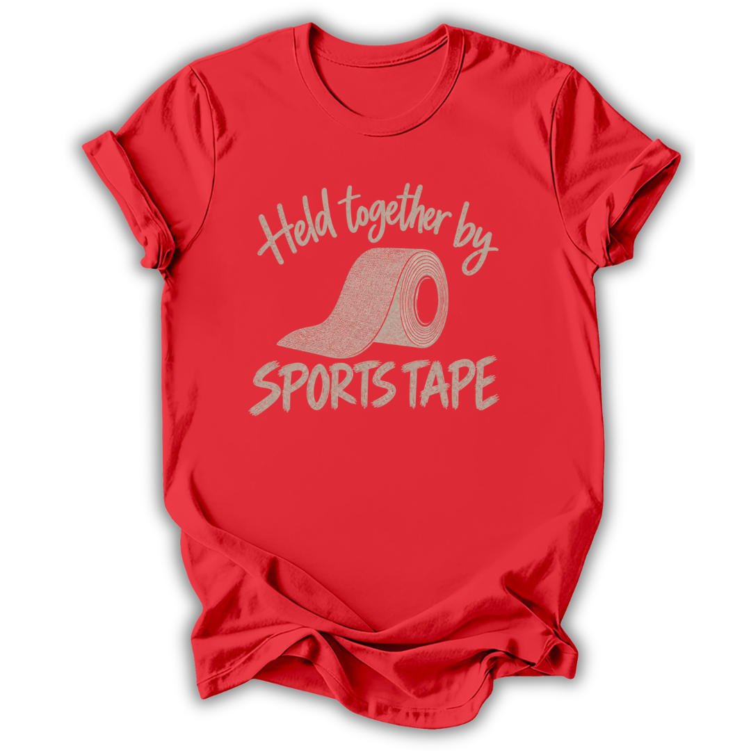 A red short-sleeve t-shirt with a graphic print that reads 'Held together by SPORTS TAPE' in a light pinkish-beige glitter-texture font, featuring an illustration of a sports tape roll in the center.