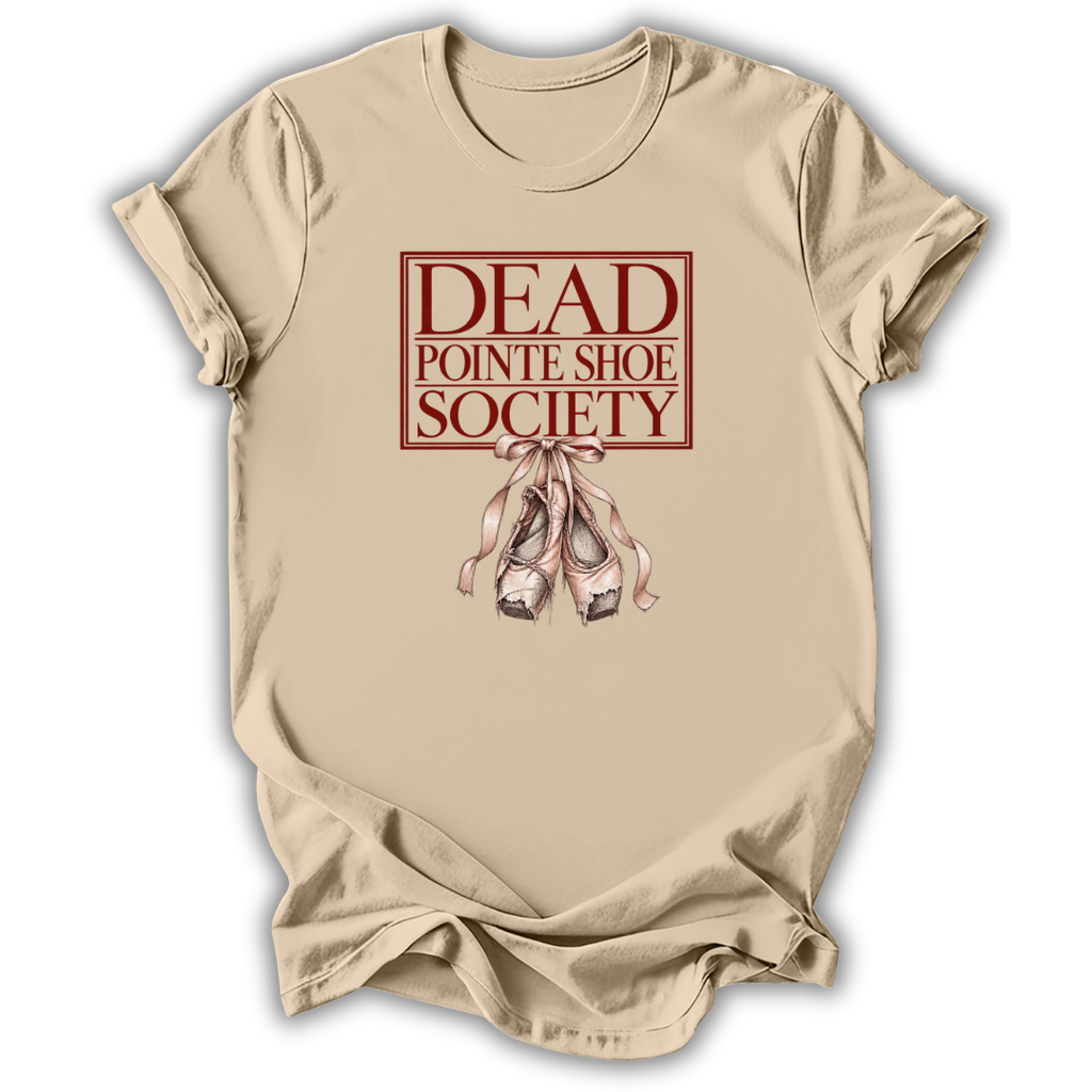 A beige short-sleeve t-shirt with a graphic print on the front reading 'DEAD POINTE SHOE SOCIETY' in dark red, above an illustration of pinkish-beige pointe shoes tied together, shown on a white background.