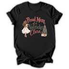 A black short-sleeve t-shirt with a graphic print on the front. The graphic features the text 'Proud Mom of a Nutcracker Clara' in pink and green lettering, accompanied by an illustration of a girl in a white dress and a decorated Christmas tree with wrapped gifts.