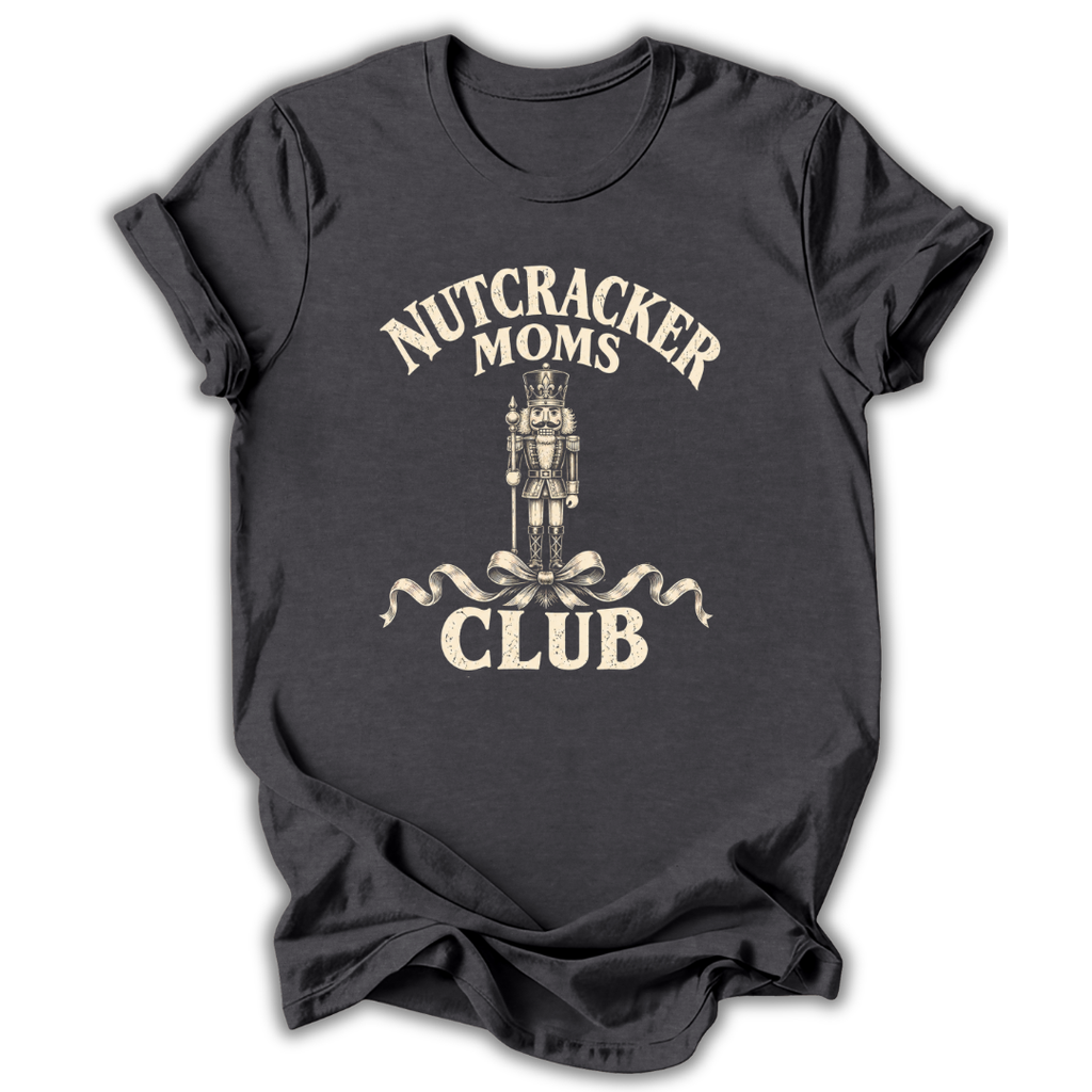 A dark charcoal gray t-shirt with a vintage-style cream graphic that reads 'NUTCRACKER MOMS CLUB' surrounding an illustration of a nutcracker and ribbon bow.