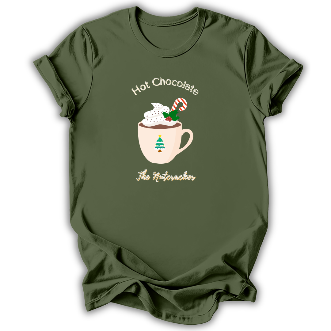 An olive green short-sleeve t-shirt with a festive graphic of a mug filled with hot chocolate, whipped cream, a candy cane, and a small Christmas tree, with the text 'Hot Chocolate The Nutacker' printed around it.