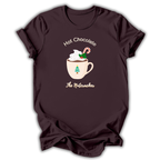 A black short-sleeve t-shirt with a graphic of a nutcracker character in a teal and peach dress, accompanied by the text 'NUTCRACKER IS MY FAVORITE SEASON' in light blue-green lettering.