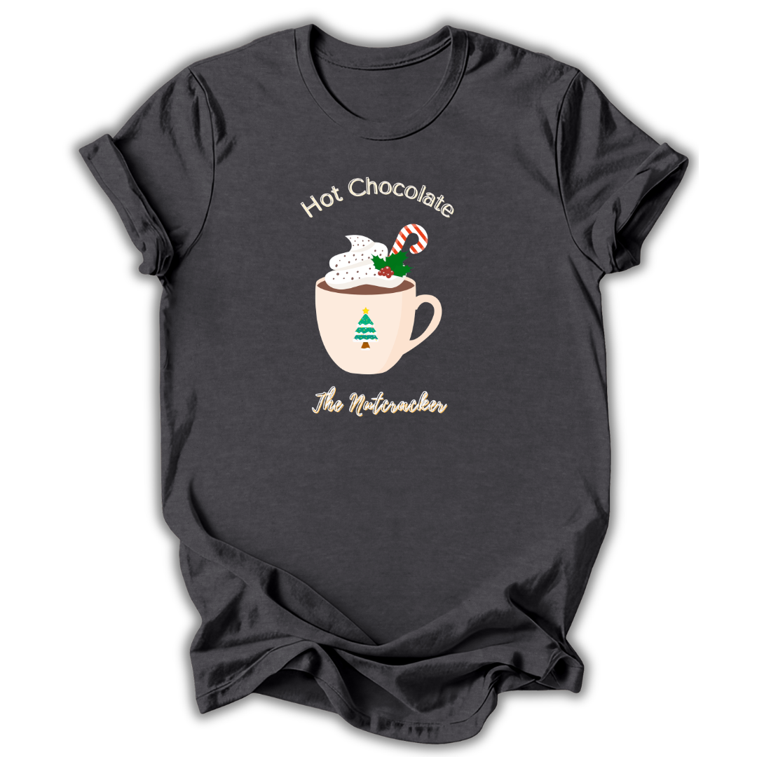 A dark charcoal gray t-shirt with a festive graphic of a mug filled with hot chocolate, whipped cream, a candy cane, and a small Christmas tree, with the text 'Hot Chocolate The Nutcracker' printed around it.